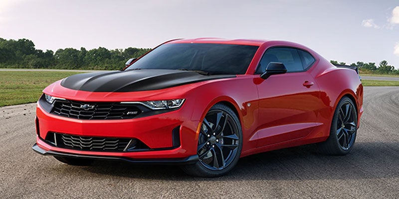 pink 2021 Chevrolet Camaro parked on road